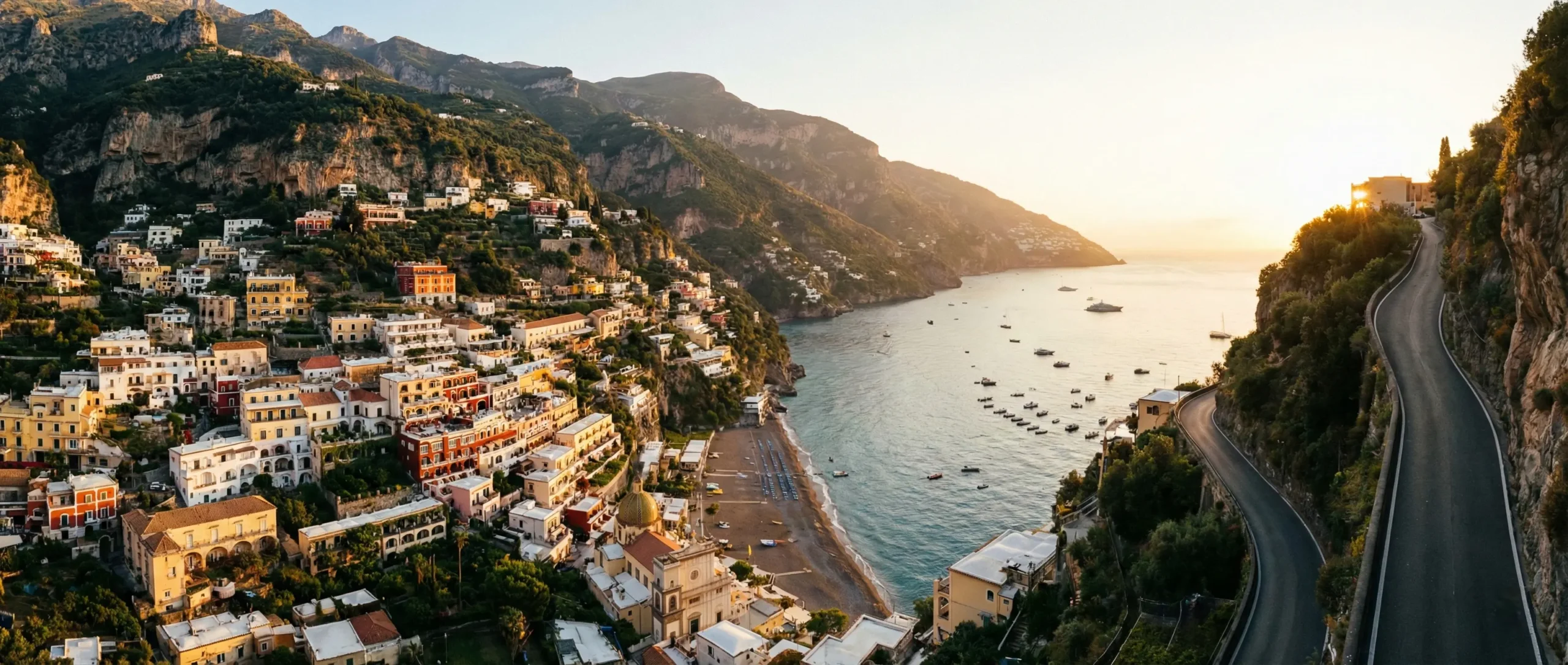 Positano Sunset Panoramic View - Amalfi Coast Breathtaking panoramic view of Positano village on the Amalfi Coast at sunset with colorful cliffside houses.